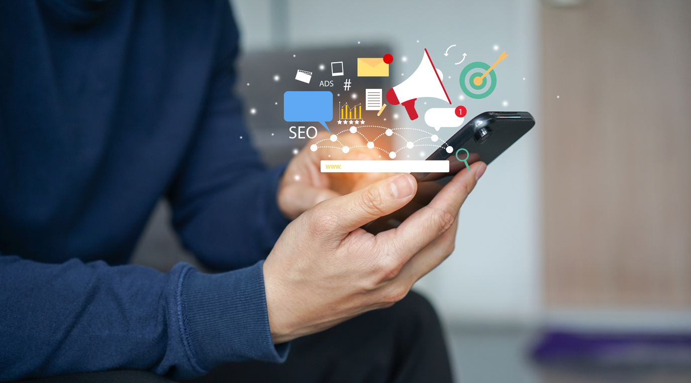 Hands holding phone showing SEO